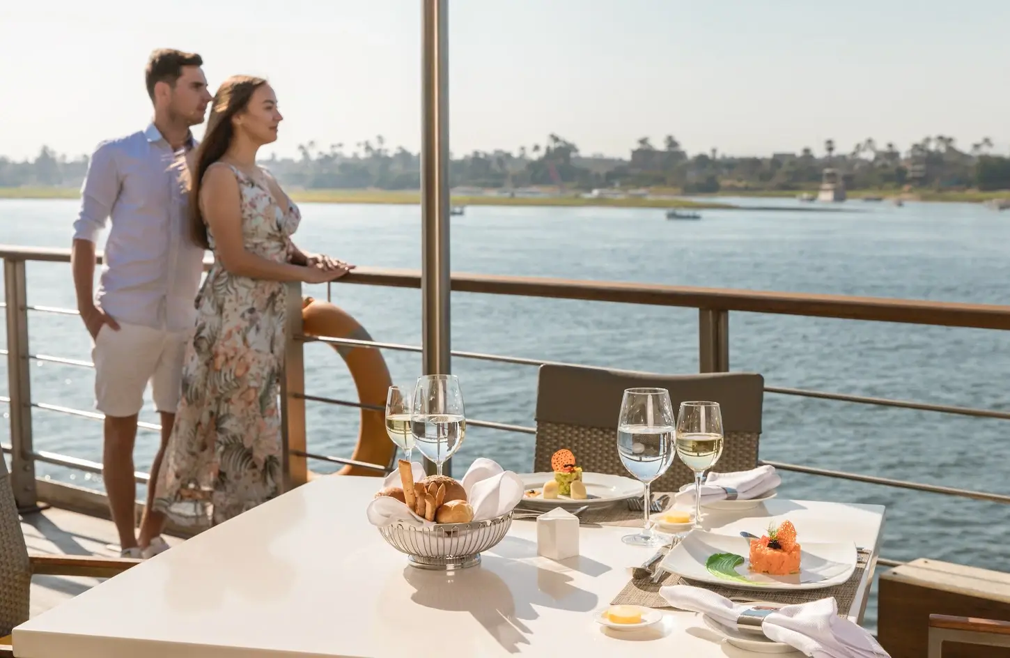 Couple standing on the deck of the ship