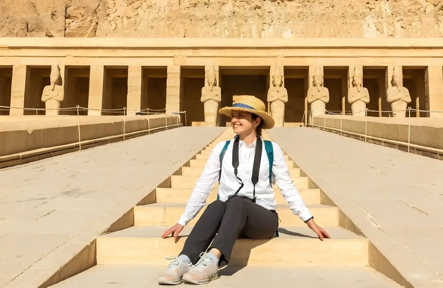 Girl sitting on the steps of Hatshepsut Temple