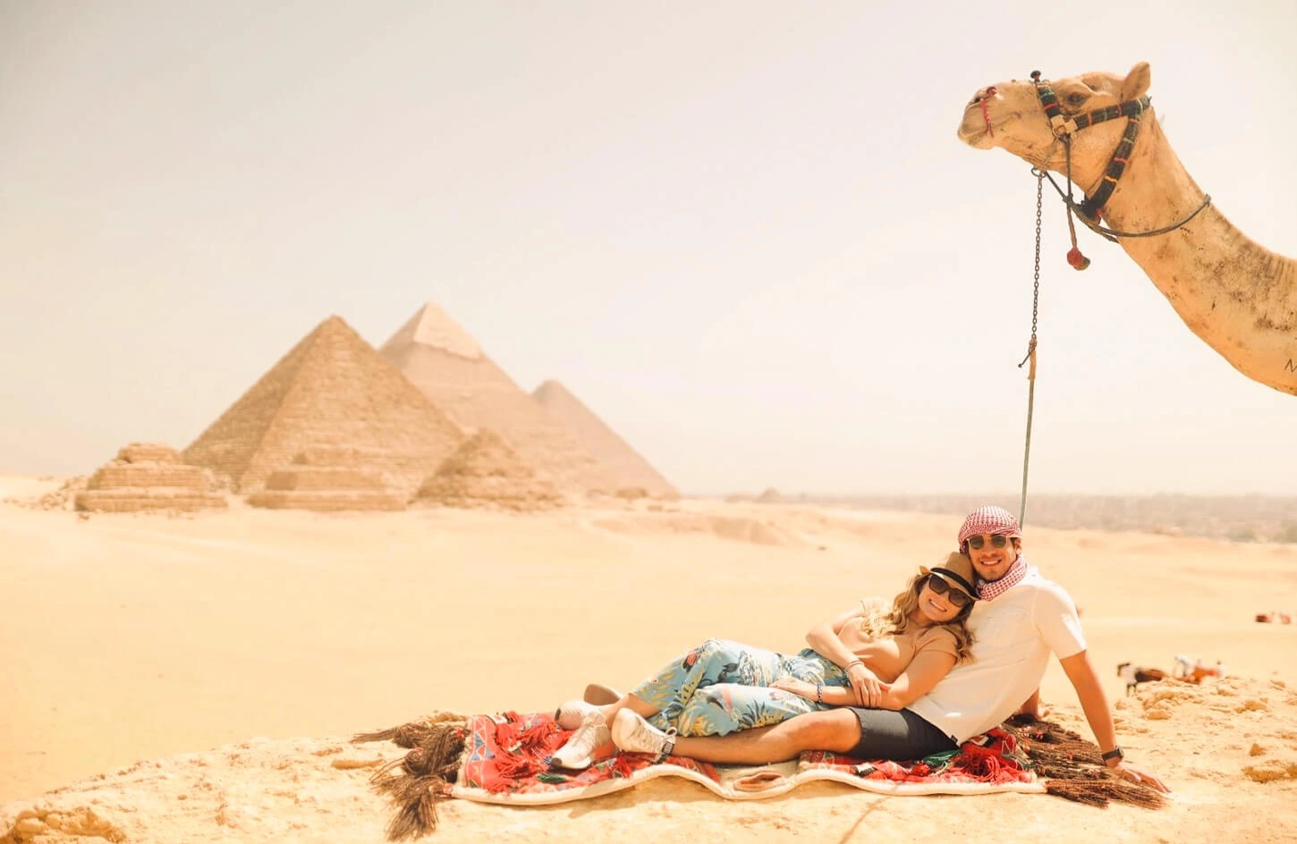 Honeymoon couple sitting in front of a temple