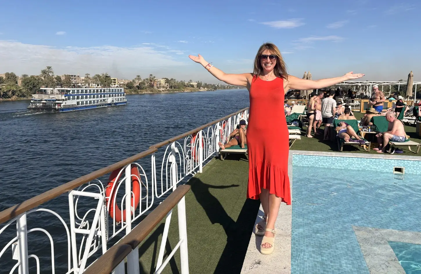 Tourist standing in front of the swimming pool